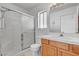 Modern bathroom with a glass-enclosed shower, vanity with storage, and updated fixtures at 3581 Pahrump Valley Blvd, Pahrump, NV 89048