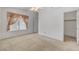 Spacious bedroom featuring neutral carpets, a window, and a closet providing ample storage at 3581 Pahrump Valley Blvd, Pahrump, NV 89048