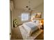 Bright bedroom with a ceiling fan, large bed, and stylish decor for a comfortable and inviting space at 3581 Pahrump Valley Blvd, Pahrump, NV 89048
