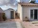 Backyard featuring low maintenance gravel, a shed, and patio area at 436 Pumpkin Way, Henderson, NV 89015