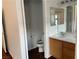 Bright bathroom features a mirrored vanity and a toilet in an alcove at 436 Pumpkin Way, Henderson, NV 89015