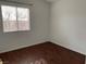 Basic bedroom with neutral walls, laminate wood flooring and a window at 436 Pumpkin Way, Henderson, NV 89015