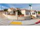 Corner-lot home featuring a terracotta tile roof, stucco facade, and manicured landscape at 436 Pumpkin Way, Henderson, NV 89015