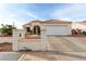 Inviting single-story home with a private driveway and desert landscaping in front at 436 Pumpkin Way, Henderson, NV 89015