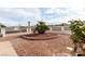Manicured front yard with decorative gravel, mature plantings, and brick border at 436 Pumpkin Way, Henderson, NV 89015