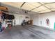 Garage with a motorcycle, storage shelves, and an automatic door opener system at 436 Pumpkin Way, Henderson, NV 89015