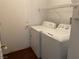 Laundry room with washer, dryer, wire shelving and door to the exterior at 436 Pumpkin Way, Henderson, NV 89015