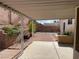 Covered patio with a concrete floor looking out to the backyard and garden at 436 Pumpkin Way, Henderson, NV 89015