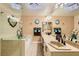 Bathroom featuring double sinks, tile flooring, and separate shower and tub at 5412 Harmony Green Dr # 101, Las Vegas, NV 89149