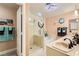 Bathroom featuring a large shower, soaking tub, double sinks, and decorative lighting at 5412 Harmony Green Dr # 101, Las Vegas, NV 89149