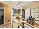 Cozy bathroom featuring granite countertops, tiled flooring, and a large mirror at 5412 Harmony Green Dr # 101, Las Vegas, NV 89149