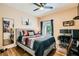 Bedroom with a ceiling fan, hardwood flooring, and a view of the outside at 5412 Harmony Green Dr # 101, Las Vegas, NV 89149