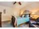 Comfortable bedroom featuring carpet, ceiling fan, and warm lighting at 5412 Harmony Green Dr # 101, Las Vegas, NV 89149