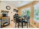 Cozy breakfast nook with natural light and room for a coffee bar offers a relaxing spot at 5412 Harmony Green Dr # 101, Las Vegas, NV 89149