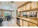Well-lit kitchen with stainless steel appliances and granite countertops offers a modern design at 5412 Harmony Green Dr # 101, Las Vegas, NV 89149