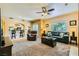 Spacious living room with plush carpeting, comfortable seating, and an open view to the kitchen at 5412 Harmony Green Dr # 101, Las Vegas, NV 89149
