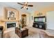Inviting living room features a fireplace and neutral color scheme for a warm and welcoming ambiance at 5412 Harmony Green Dr # 101, Las Vegas, NV 89149