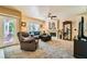 Relaxing living room showcases a fireplace, plush seating, and seamless outdoor access at 5412 Harmony Green Dr # 101, Las Vegas, NV 89149
