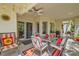 Inviting covered patio featuring comfortable seating and lush landscaping around the area at 5412 Harmony Green Dr # 101, Las Vegas, NV 89149