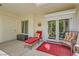 Cozy patio area with outdoor seating, perfect for enjoying fresh air and relaxing with easy access to the home's interior at 5412 Harmony Green Dr # 101, Las Vegas, NV 89149