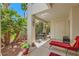 Shaded patio with seating, native plants, and desert landscaping, perfect for outdoor living at 5412 Harmony Green Dr # 101, Las Vegas, NV 89149
