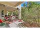 Charming covered patio with outdoor seating and lush landscaping, ideal for relaxing at 5412 Harmony Green Dr # 101, Las Vegas, NV 89149