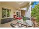 Inviting covered patio area, perfect for relaxing and entertaining with stylish furniture and lush greenery around at 5412 Harmony Green Dr # 101, Las Vegas, NV 89149
