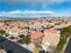 Overhead view of colorful homes, trees, and well-manicured lawns in a planned community with mountain views at 6790 Gold Yarrow St, Las Vegas, NV 89148