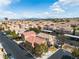 An aerial view showcases a community with rows of houses, each featuring unique colors and well-maintained lawns at 6790 Gold Yarrow St, Las Vegas, NV 89148