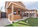 Backyard with covered patio, built-in bar and BBQ, putting green and lots of room to relax and entertain at 6790 Gold Yarrow St, Las Vegas, NV 89148