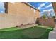 The Backyard features a vibrant artificial turf putting green and thoughtfully designed landscaping for outdoor enjoyment at 6790 Gold Yarrow St, Las Vegas, NV 89148