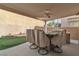 Outdoor dining area with built-in grill and granite countertop, ideal for entertaining at 6790 Gold Yarrow St, Las Vegas, NV 89148