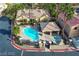 Community pool featuring a cabana, spa, and ample seating for relaxing at 6790 Gold Yarrow St, Las Vegas, NV 89148