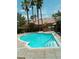 Community swimming pool with sun shelves, steps and stainless handrails at 6790 Gold Yarrow St, Las Vegas, NV 89148