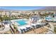 This aerial view showcases the pool area with both a pool and splash pad at 6804 Surf Green Ct, North Las Vegas, NV 89086