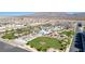 This aerial view shows the manicured landscaping and inviting pool of this community at 6804 Surf Green Ct, North Las Vegas, NV 89086