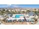 This aerial view showcases the pool area with both a pool and splash pad at 6804 Surf Green Ct, North Las Vegas, NV 89086