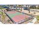 Community basketball court with well-maintained surface and equipment, surrounded by lush landscaping at 6804 Surf Green Ct, North Las Vegas, NV 89086