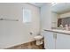 This bathroom has a sink and vanity with a countertop and brushed metal hardware at 6804 Surf Green Ct, North Las Vegas, NV 89086