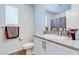 Bathroom features a vanity with granite countertop and a toilet at 6804 Surf Green Ct, North Las Vegas, NV 89086