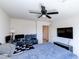 This bedroom has a ceiling fan and access to an adjacent room through a doorway at 6804 Surf Green Ct, North Las Vegas, NV 89086