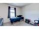 Cozy bedroom with a twin bed and window with curtains at 6804 Surf Green Ct, North Las Vegas, NV 89086