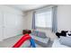 Bedroom with a window and closet with a play area at 6804 Surf Green Ct, North Las Vegas, NV 89086