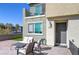 Inviting front patio with comfortable seating, perfect for enjoying outdoor moments at 6804 Surf Green Ct, North Las Vegas, NV 89086