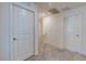 Upstairs hallway with neutral carpet and doors to rooms at 6804 Surf Green Ct, North Las Vegas, NV 89086