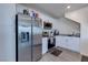 Bright kitchen features stainless steel appliances, granite countertops, and white cabinetry at 6804 Surf Green Ct, North Las Vegas, NV 89086