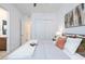 Stylish bedroom with ensuite bathroom features a large closet and decorative pillows at 794 Willits St, Las Vegas, NV 89138