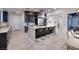 Modern kitchen with a large island, stainless steel appliances, and sleek cabinetry at 794 Willits St, Las Vegas, NV 89138