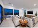 Bright living room boasting large windows with views, modern furniture, and a sleek entertainment center at 794 Willits St, Las Vegas, NV 89138