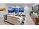 Open living room showcasing a comfortable seating area, views of a pool, and stylish decor at 794 Willits St, Las Vegas, NV 89138
